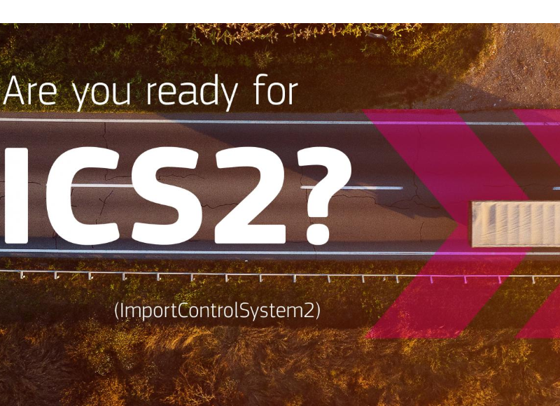 Aerial road banner reading “Are you ready for ICS2? (Import Control System 2)” with a truck and pink arrows.